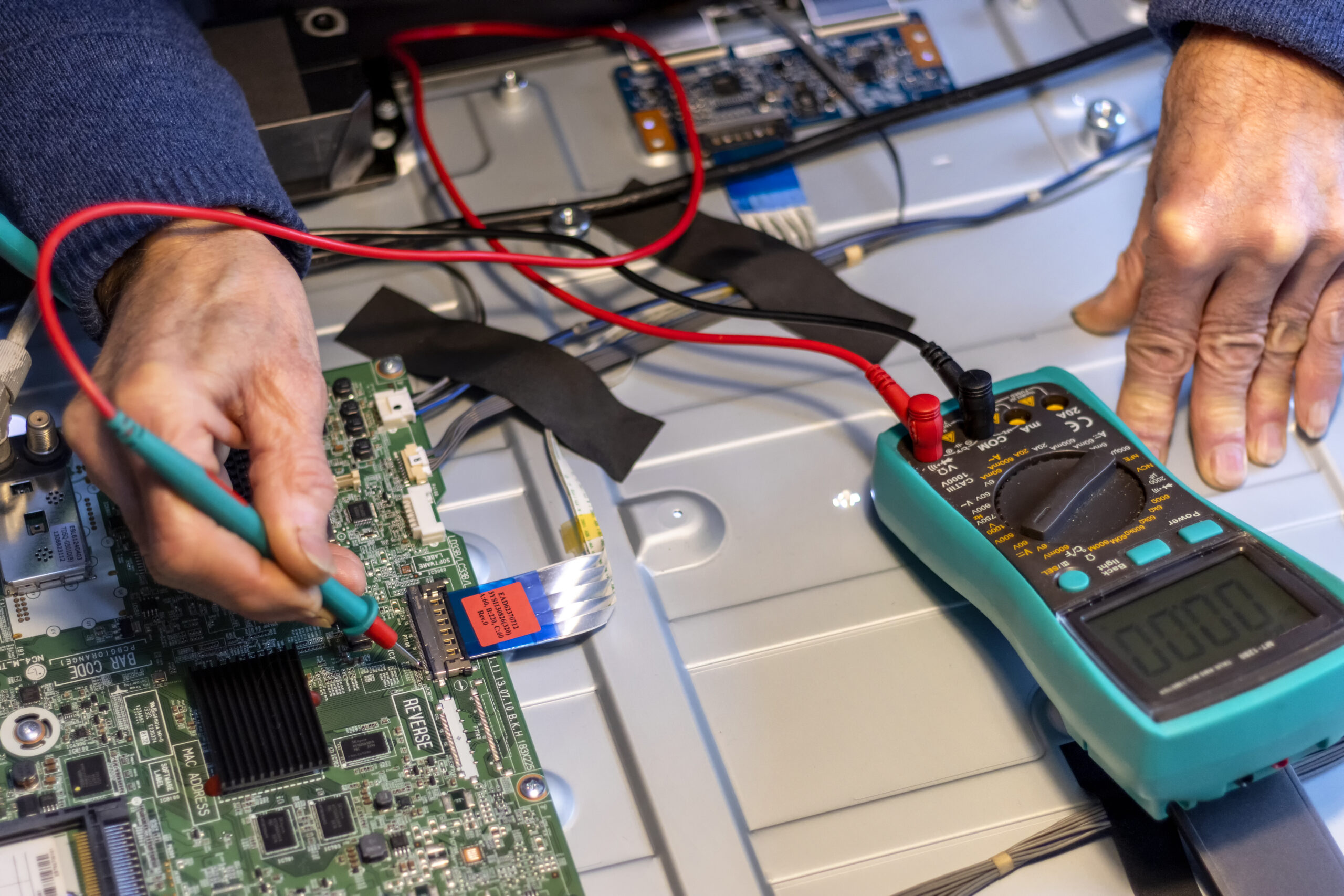 senior electronics technician checks the component 2025 03 10 11 01 48 utc scaled